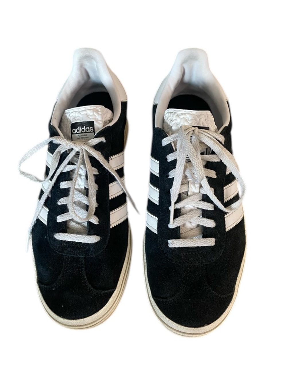 Classic Adidas Gazelle sneakers in black suede with iconic white stripes